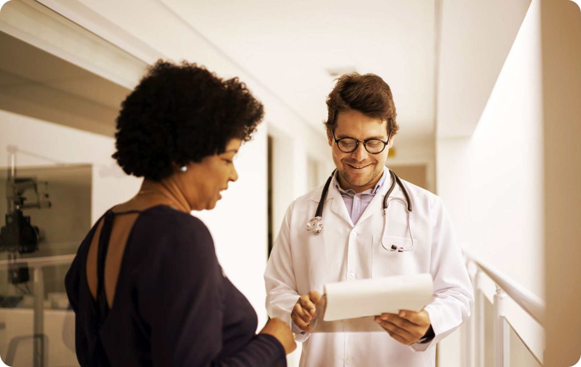 Woman speaking to doctor